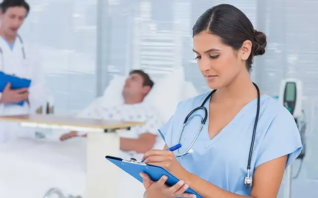 Healthcare supervisor leading a team meeting